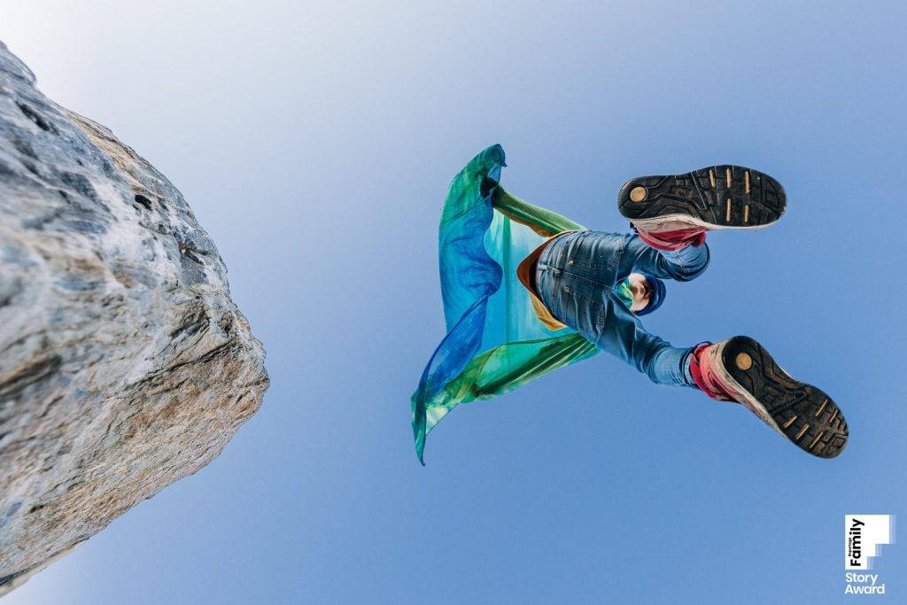 Boy plays Superhero and jumps from a rock - Awarded documentary Family photographer